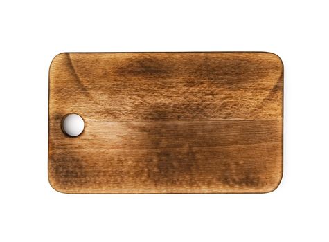 Dark wooden cutting board on white background, close up