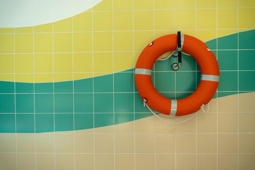 rescue circle on the wall hanging, at home in the sports pool