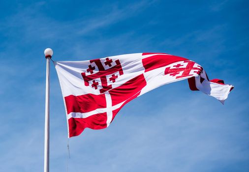 photo of maltese flag in the sky in Valletta