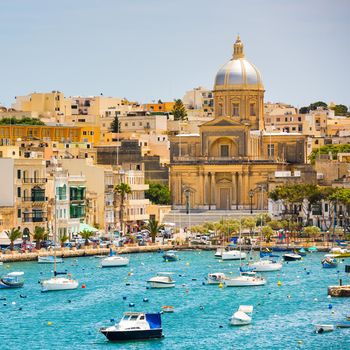 many little yachts and boats from plan wiev to the bay near Valletta in Malta