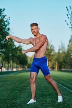 man doing exercises in the park inflated body. High quality photo