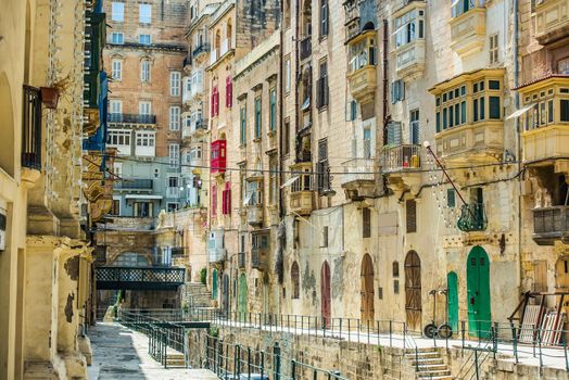 street with colorful vintage gates and balconies in Valletta historical center in Malta