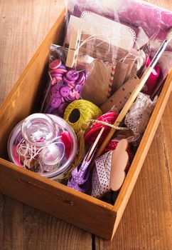 Scrapbooking craft materials in a wooden box