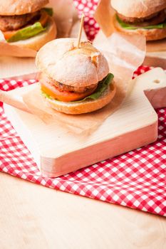 mini burgers with tomato, lettuce and meat cutlet