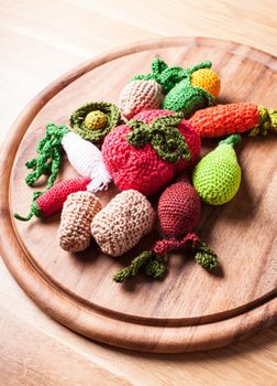 Crochet vegetables on a wooden board - eco toys or kitchen decor
