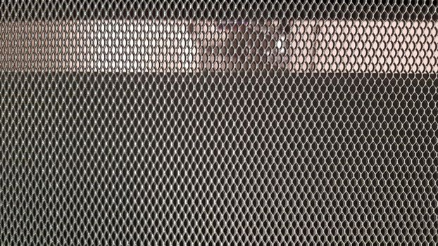 Abstract industrial metallic netting background, pattern, texture. Mesh gray background.