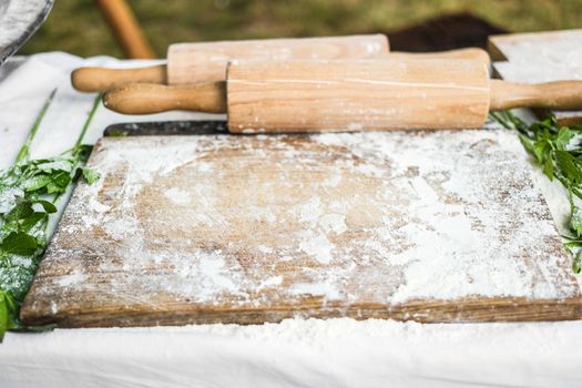 working surface for dough with wooden board and rolling-pin