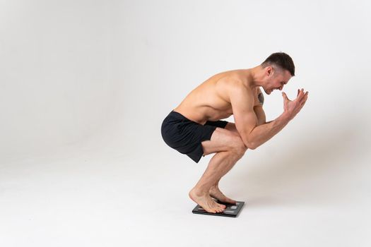 Man with weights health pondered, health and sports on a white background back body backache medicine, hand chronic. sickness, back suffer attractive