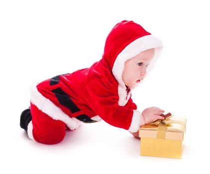 Little Santa boy with gold gift box isolated on white
