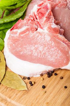 Raw loin slices on the board close up