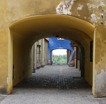 blue archway in historical part of Warsaw
