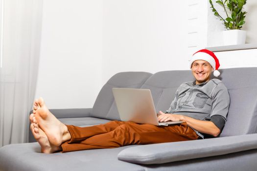 Man shopping for Christmas gifts online
