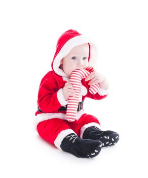 Little Santa boy with staff isolated on white background