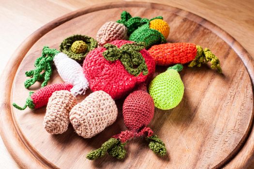 Crochet vegetables on a wooden board - eco toys or kitchen decor