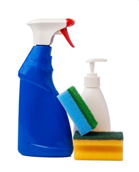 Bottles with cleaning products and sponge on a white isolated background, copy space