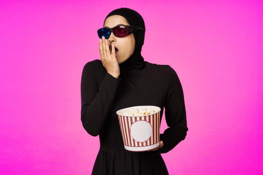 cheerful woman in 3D glasses popcorn entertainment movies model ethnicity. High quality photo