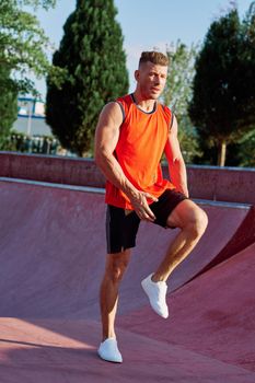 man doing exercises outdoors in the park. High quality photo