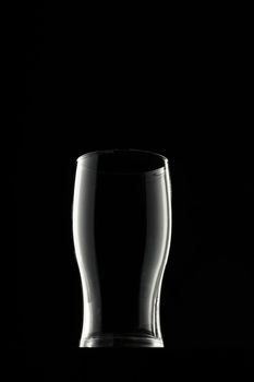 Empty glass on black background