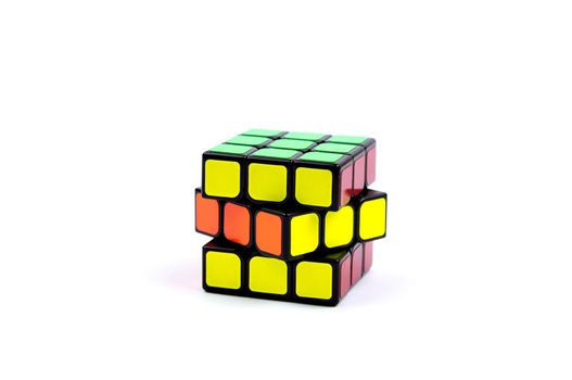 Game multi-colored cube on a white background. Game concept with copy space for text.