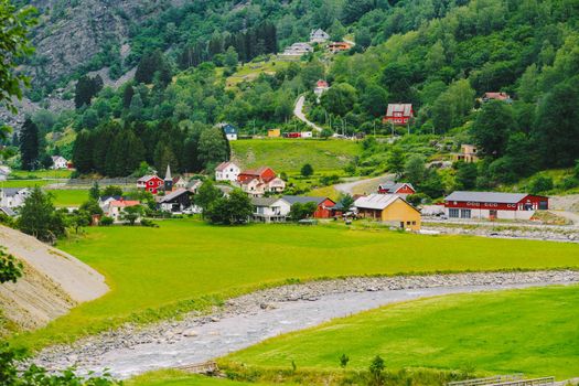Norway mountain landscape with country houses. Aerial view of the Norwegian village Flam. village of Flam laying on the banks of the river Flam in Norway.
