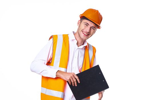 working man in orange uniform posing construction. High quality photo