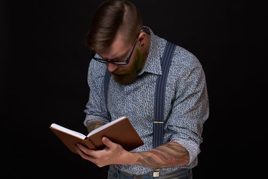 a business man in a shirt with a notebook in the hands of a manager. High quality photo