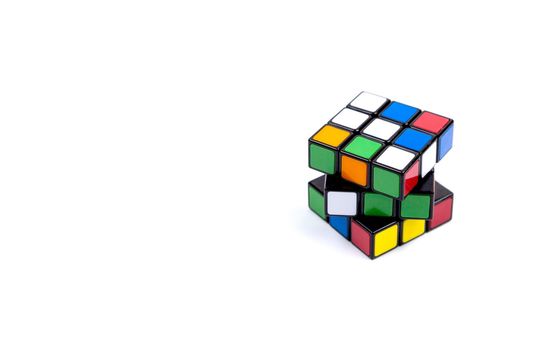 Game multi-colored cube on a white background. Game concept with copy space for text.
