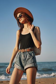 woman walking on the beach landscape sun fun lifestyle. High quality photo