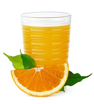 Fresh orange juice in glass isolated on white background