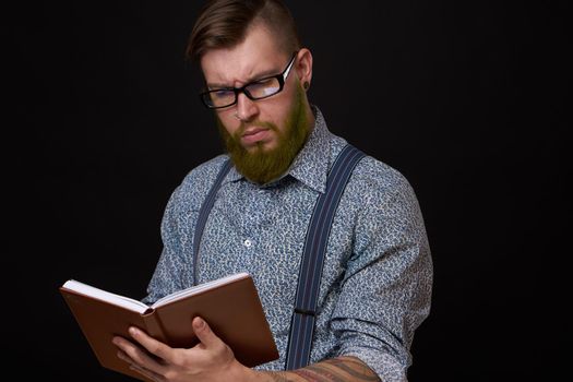 a business man in a shirt with a notebook in the hands of a manager. High quality photo