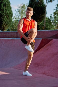 man doing exercises outdoors in the park. High quality photo