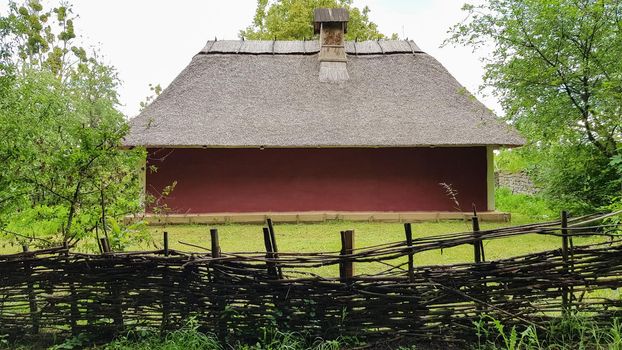 Ukraine, Kiev - June 11, 2020. The old house of peasants in the museum Pirogovo. National Museum of Folk Architecture and Everyday Life of Traditional Folklore Houses of Different Regions of Ukraine.