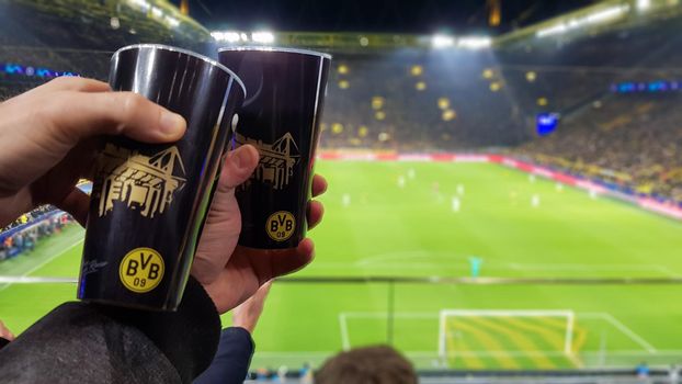 Germany, Dortmund - February 18, 2020. Borussia fans celebrate their teams victory during a match at the BVB home stadium with the French team Paris Saint - Germain, PSG.