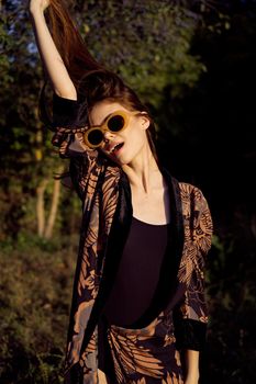 woman wearing sunglasses outdoors posing fashion. High quality photo