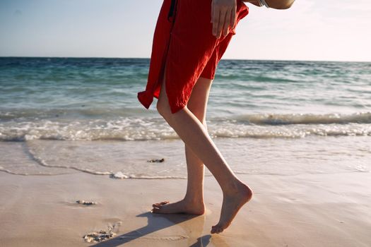 female feet ocean shore sand summer travel. High quality photo