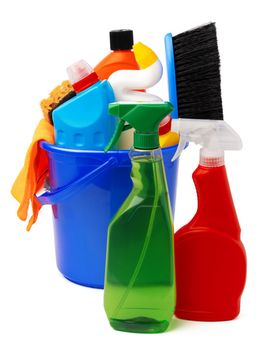 Liquid detergents and cleaning supplies in plastic bucket on white background, close up