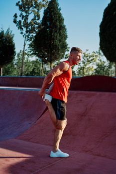 sports man doing exercises on the sports field fitness. High quality photo