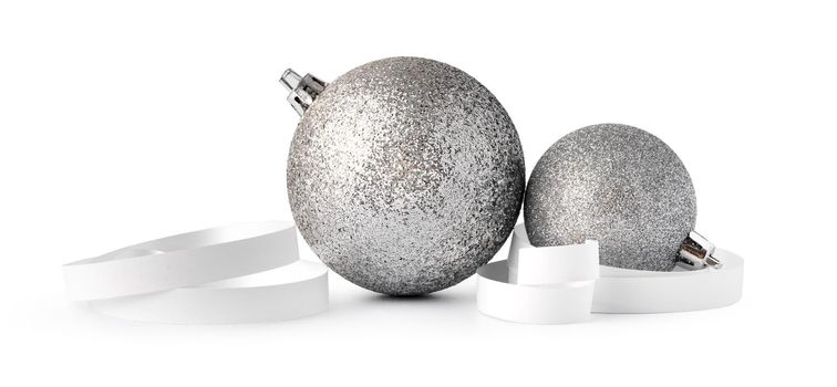 Silver sparkling Christmas baubles isolated on white background, close up