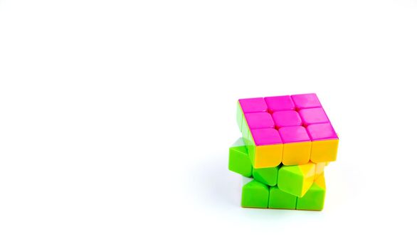 Game multi-colored cube on a white background. Game concept with copy space for text.