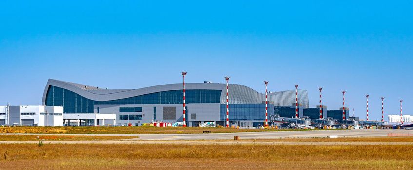 Modern airport terminal building in Russia on sunny day photo