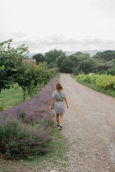 Woman walking by the lavender field