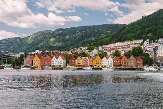 Bergen, Norway. View of historical buildings in Bryggen. Hanseatic wharf in Bergen, Norway July 28, 2019. UNESCO. Famous Bryggen street with wooden colored houses in Bergen Akerbrygge distric.