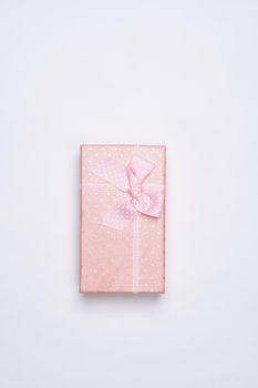 gift pink box with flowers holiday top view light background. High quality photo