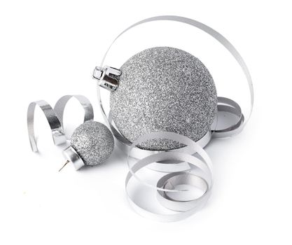 Silver sparkling Christmas baubles isolated on white background, close up