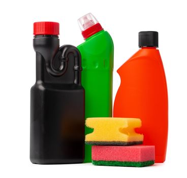 Bottles with cleaning products and sponge on a white isolated background, copy space