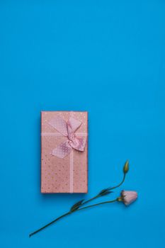 gift box flowers holiday wedding blue background. High quality photo