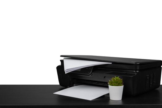 Laser home printer on table against white background, close up