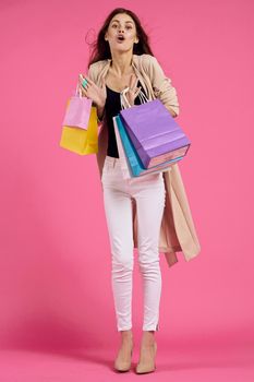 glamorous woman attractive look shopping smile summer style pink background. High quality photo