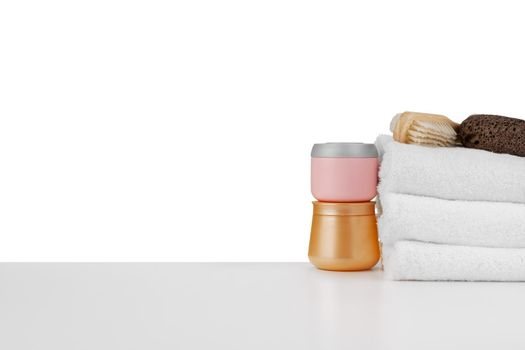 Spa still life with stacked of stone and towel isolated on white background