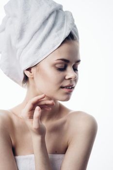 woman after shower with towel on head posing skin care. High quality photo